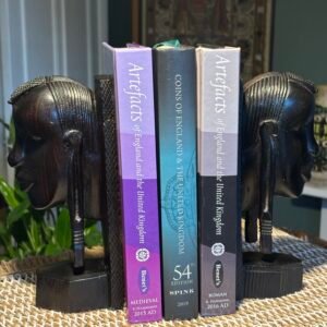 A stunning pair of vintage African hand carved mid century hardwood bookends