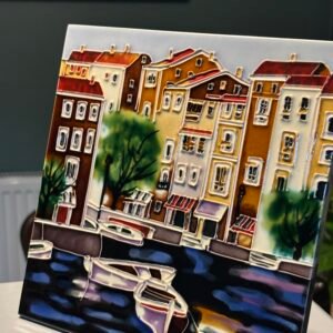 A beautiful vintage handcrafted Benaya art ceramic tile featuring a Mediterranean waterfront scene.