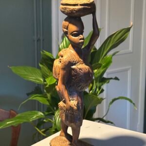 Vintage African hand-carved wooden statue of a woman carrying a basket and child.