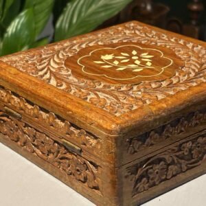 Vintage Indian hand-carved wooden trinket or jewelry box with a hinged lid and floral inlay design.